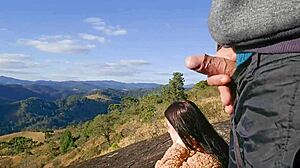 Tourist Guide Shows Something to Tourist on Mountain