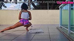 brunette trains outdoors with shorts up her ass