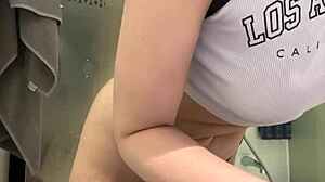 The young amateur girl performs extreme fingering on her wet pussy in the hotel room