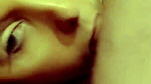 Redhead milf eagerly sucking on a throbbing hard cock in close-up view.