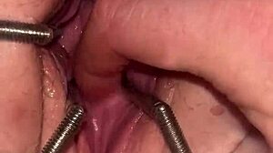 Watch the fist queen get her pussy stretched with a metal ring in this extreme session!