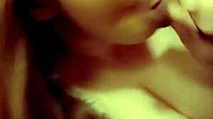 Redhead milf eagerly sucking on a throbbing hard cock in close-up view.