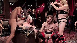 Slaves Gagging In Bondage At BDSM Party