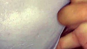 Ebony woman rubs her wet creamy pussy