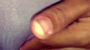 Ebony woman rubs her wet creamy pussy