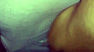 Ebony woman rubs her wet creamy pussy