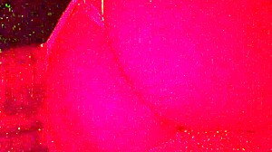 Masked in the red light sucking on something