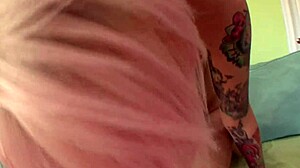 tattooed milf riding cock at home
