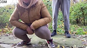 Curvy milf squats and pisses outdoors