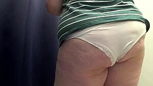 big ass in white panties tries tight leggings in fitting room