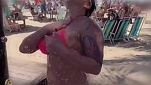 who likes seeing me suck this big black cock on the beach?
