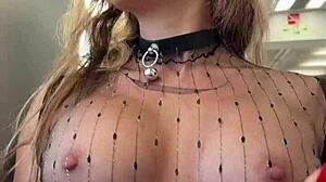 Woman flashes pierced nipples on train in sheer top