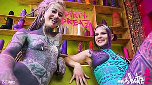 these two tattooed lesbians are having anal fun with big toys, gaping and orgasming.