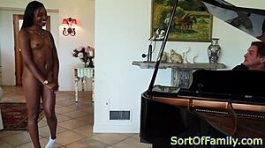 Black stepdaughter positioned by the piano