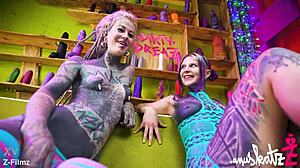 these two tattooed lesbians are having anal fun with big toys, gaping and orgasming.