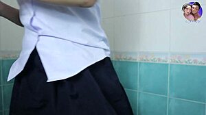 Horny student touches herself in bathroom