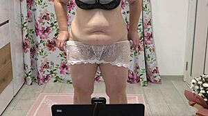 chubby woman shaking in different panties near webcam, showing figure at home