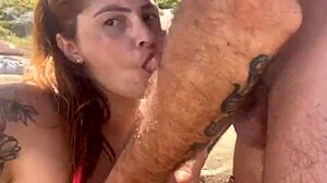 African teases huge cock blowjob on beach