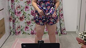 chubby woman shaking in different panties near webcam, showing figure at home
