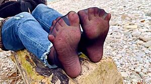 beautiful nylon feet teasing in jeans outdoor