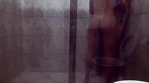in the steamy bathroom, a muscular couple with huge asses and massive cocks engages in intense fucking and deepthroat sucking, their bodies glistening under the shower spray