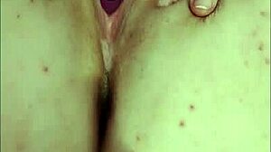 Young woman relaxes with toys in solo session