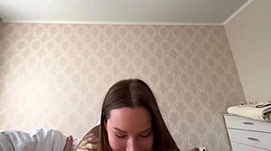 A couple engages in homemade intimate activities accompanied by vocal expressions.