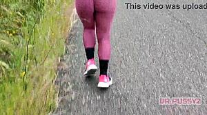 Big ass ebony in leggings running alone in the forest.