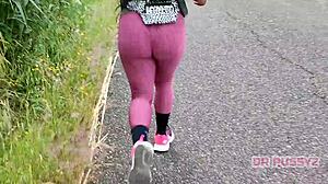 Big ass ebony in leggings running alone in the forest.