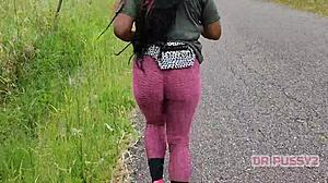 Big ass ebony in leggings running alone in the forest.
