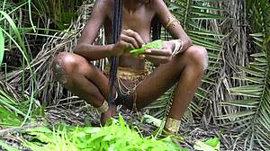 hot african native woman prepares a meal in the jungle kitchen