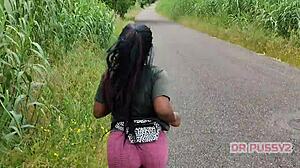 Big ass ebony in leggings running alone in the forest.