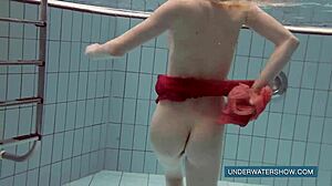 katya okuneva in red dress by the pool