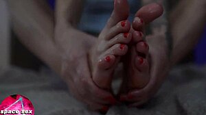 sexy girl plays with foot closeup in oiled feet fetish