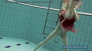 katya okuneva in red dress by the pool