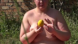 BBW Masturbates Outdoors, Pushing Lemon from Hairy Pussy with Gaping Hole