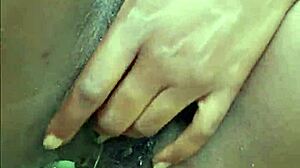 Horny ebony woman pisses publicly in wet outdoor spot