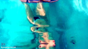 Underwater lesbian strap on sex