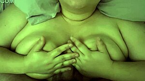 Surprise cumshot during titfuck