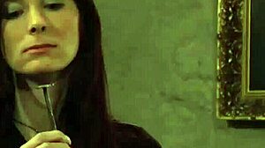 Putting slave mark on her pussy in femdom bondage