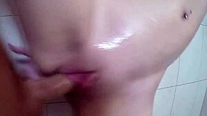 Showering Beauty Receives Facial Cumshot In POV