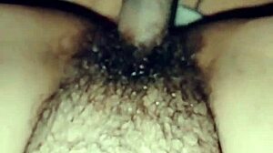 Perra madura masturbates with her consolador, teasing pleasure.