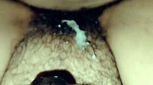 Perra madura masturbates with her consolador, teasing pleasure.