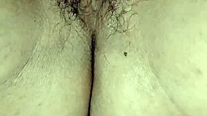 Perra madura masturbates with her consolador, teasing pleasure.