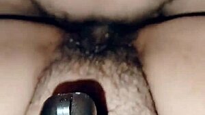 Perra madura masturbates with her consolador, teasing pleasure.