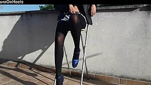 denim shorts black tights and gorgeous 8 inch heels on her