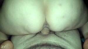 A mature woman passionately rides a massive cock in POV, deepthroating before the intense session unfolds with big tits bouncing.