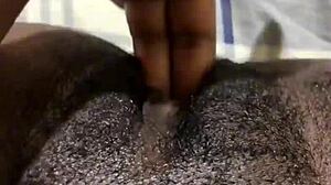 Black amateur engages in solo pussy play with masturbation, reaching wet orgasm