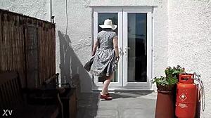 Naughty girl strips naked in the garden, feeling free outdoors.