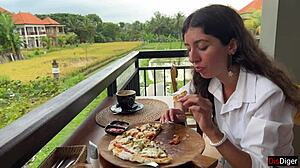 Girl with cum on face eats pizza in cafe